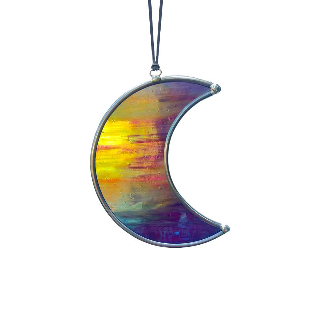 Colorful crescent-shaped glass ornament on a white background