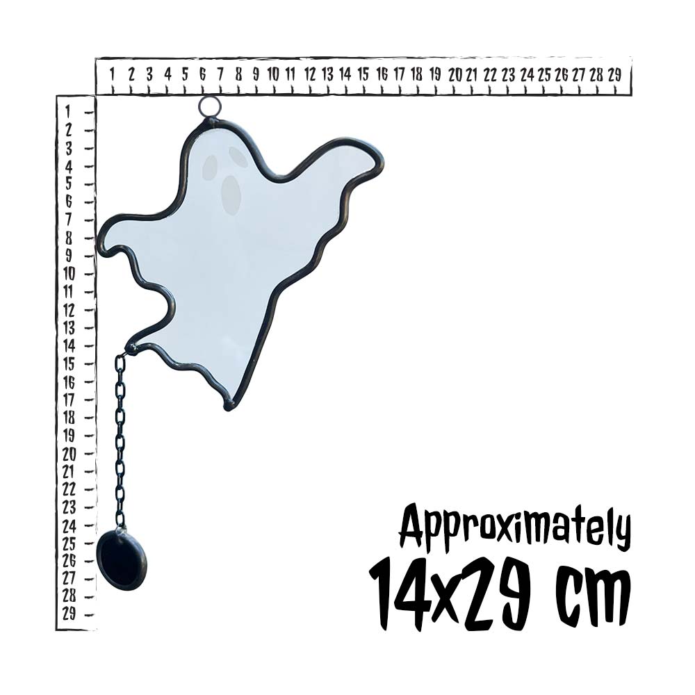 Ghost-shaped ornament with chain on a white background with measurement scale