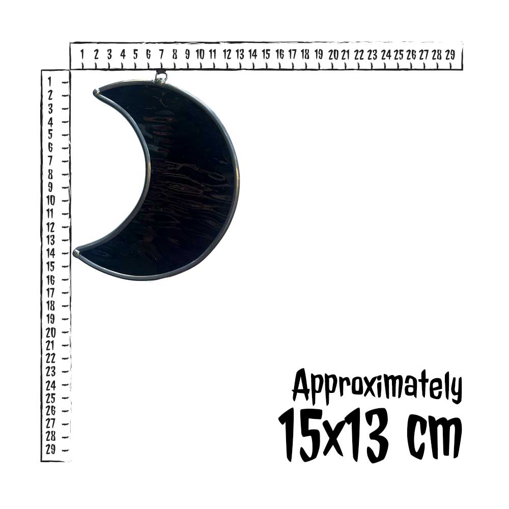Black crescent moon-shaped decor piece with a measurement scale on a white background