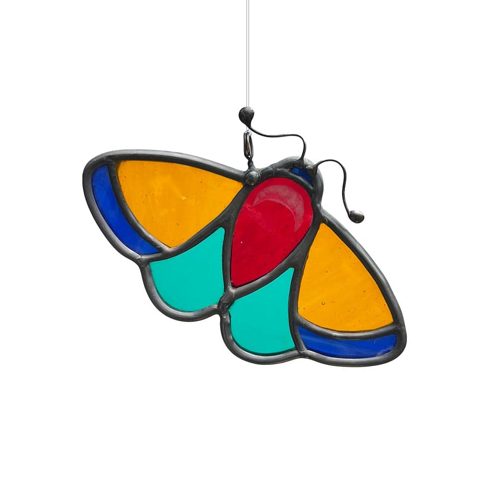 Ultra vibrant multicoloured stained glass moth decor piece, handcrafted to brighten windows.