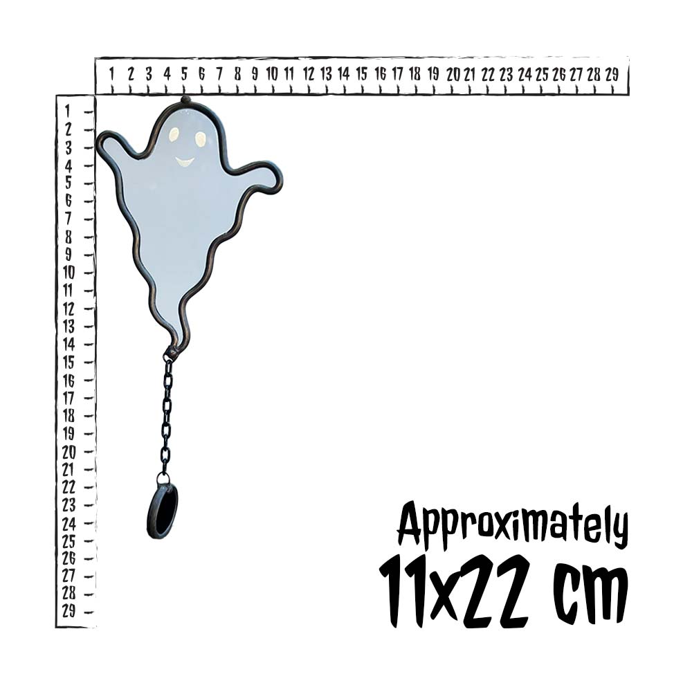 Ghost-shaped keychain with a ruler for scale on a white background