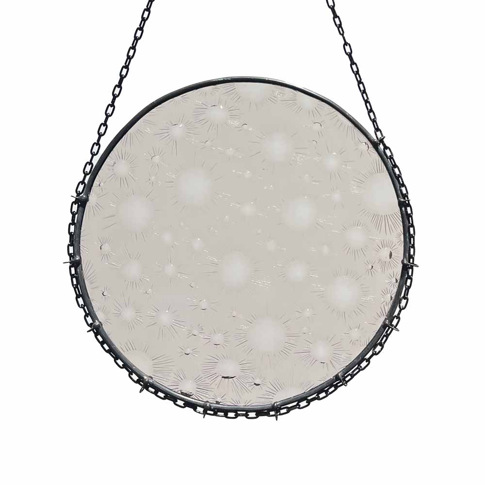 Full moon decorative stained glass piece with clear smoky glass and crater-like texture adorned with a metalling chain for hanging.