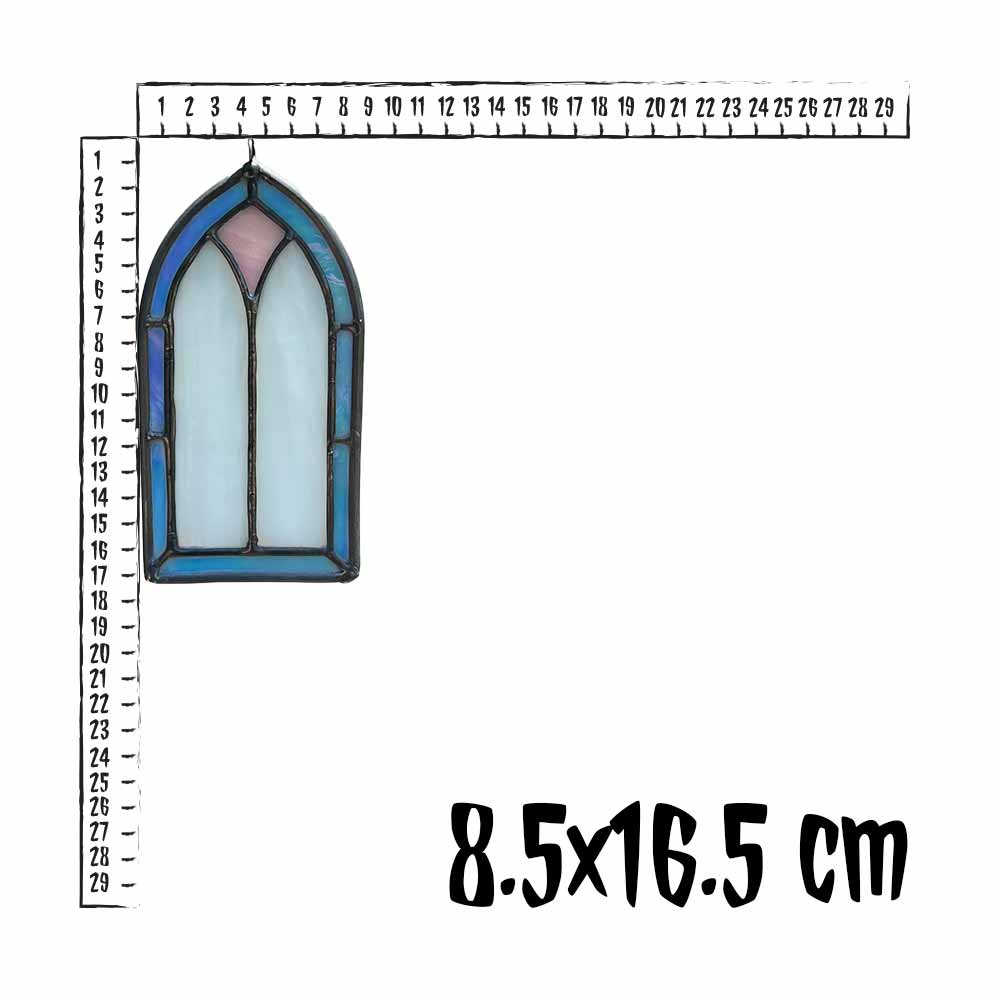 Iridescent stained glass window design with a ruler for scale on a white background