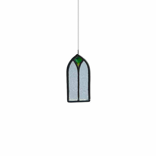 Stained glass window hanging on a white background
