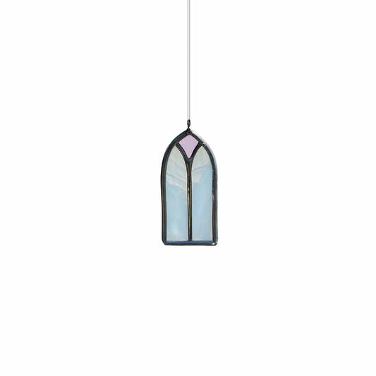 White and pink stained glass window hanging on a white background
