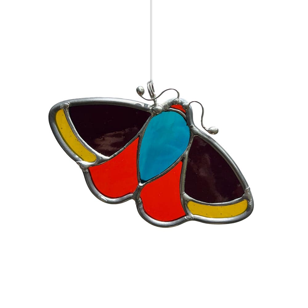 Vibrant multicoloured stained glass moth suncatcher, handmade to brighten windows.