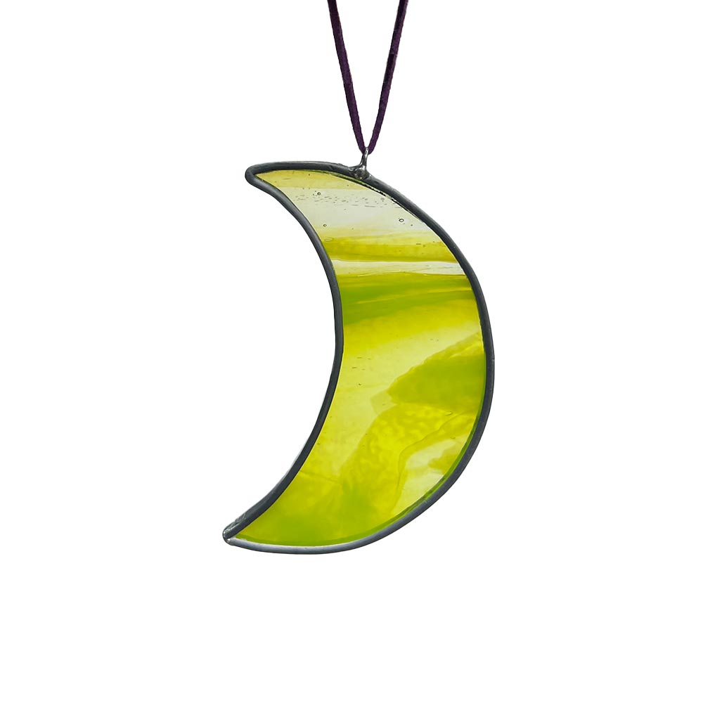 Vibrant neon-yellow stained glass moon suncatcher, handcrafted bold and fluorescent decor.