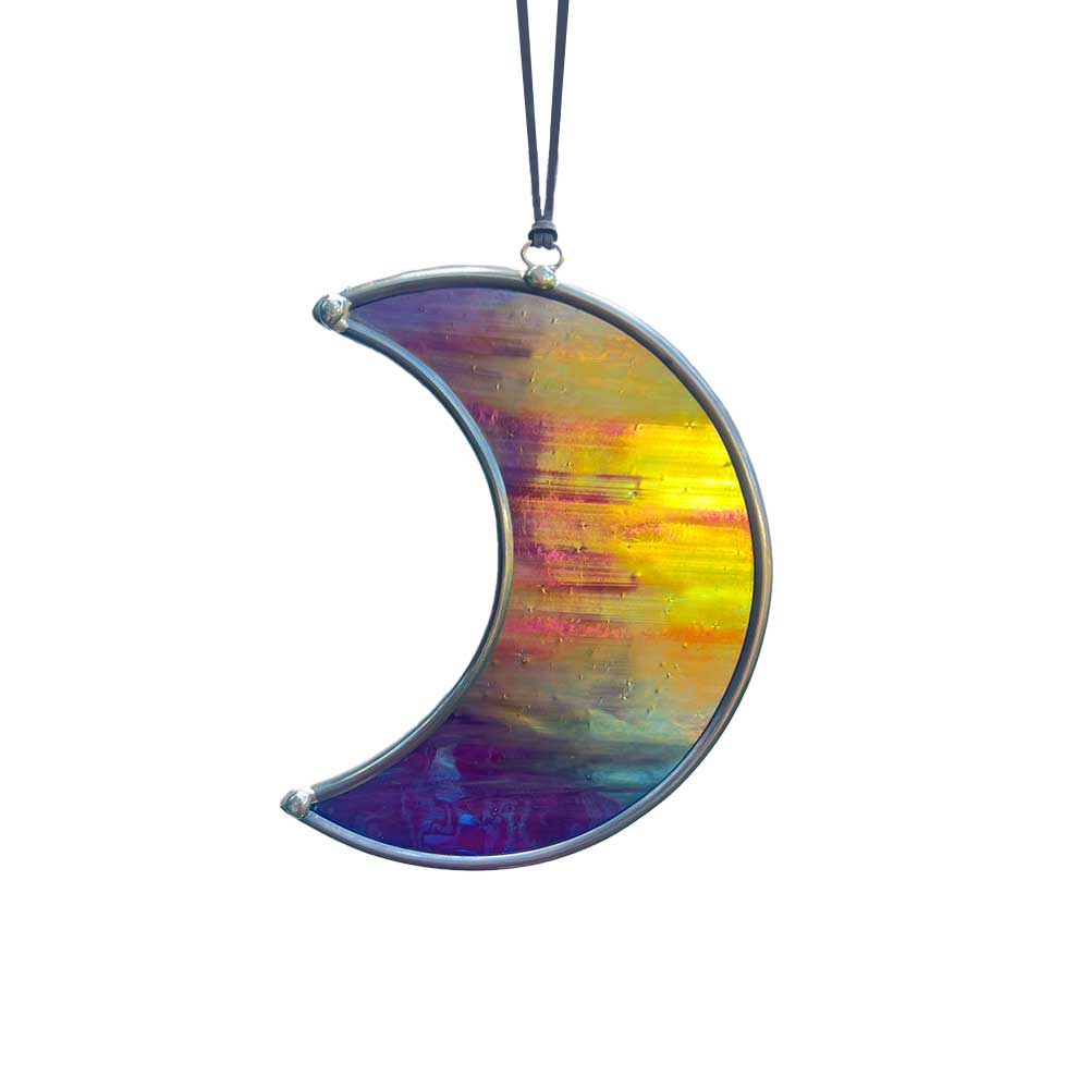 Colorful crescent-shaped glass ornament on a white background