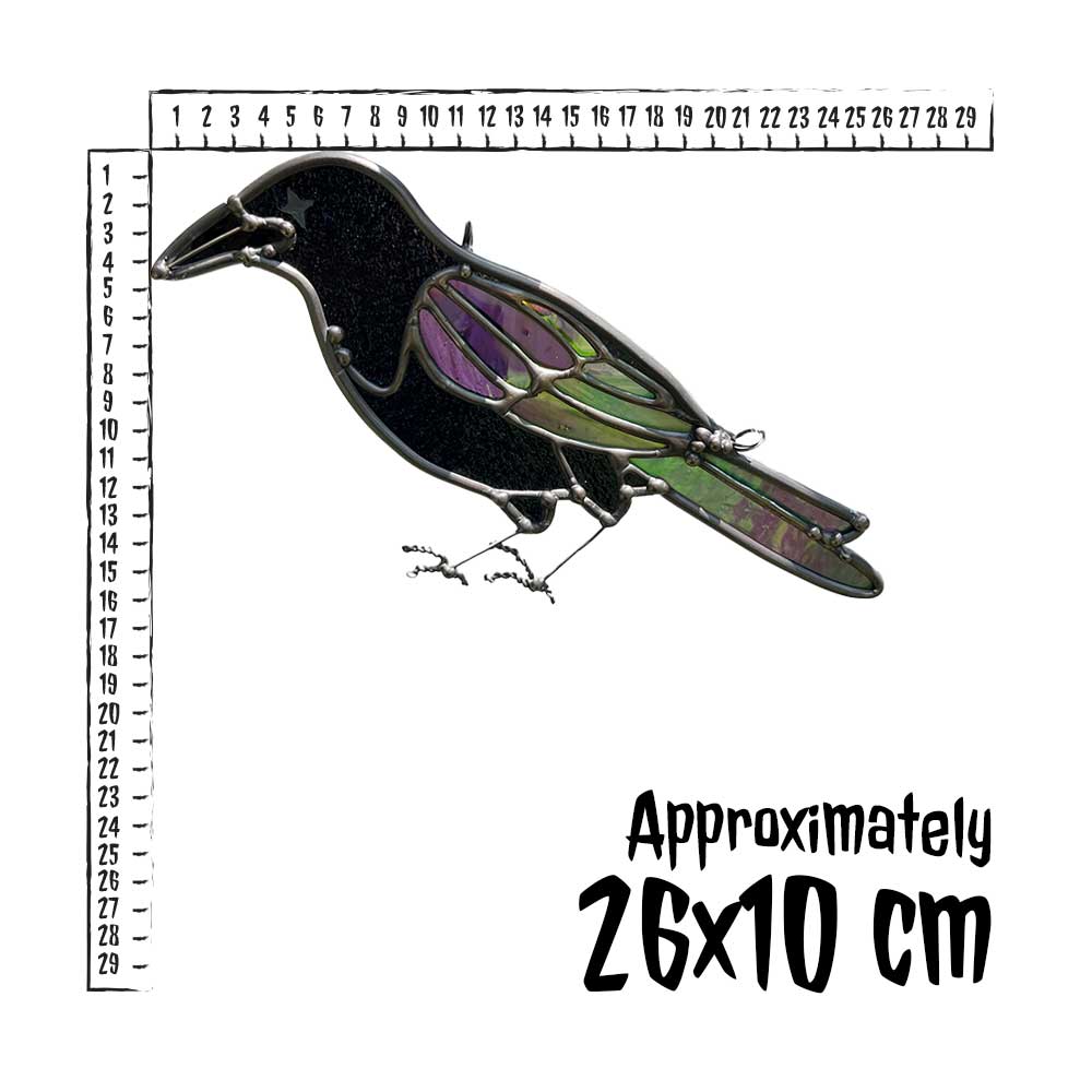Decorative stained glass crow with a ruler for scale on a white background