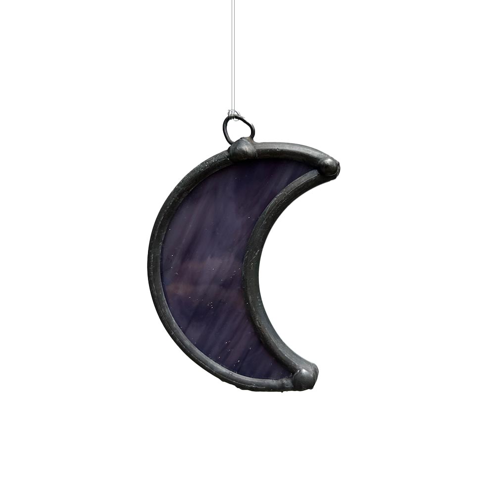 Deep purple stained glass moon, handcrafted window decor piece with mystical tones.