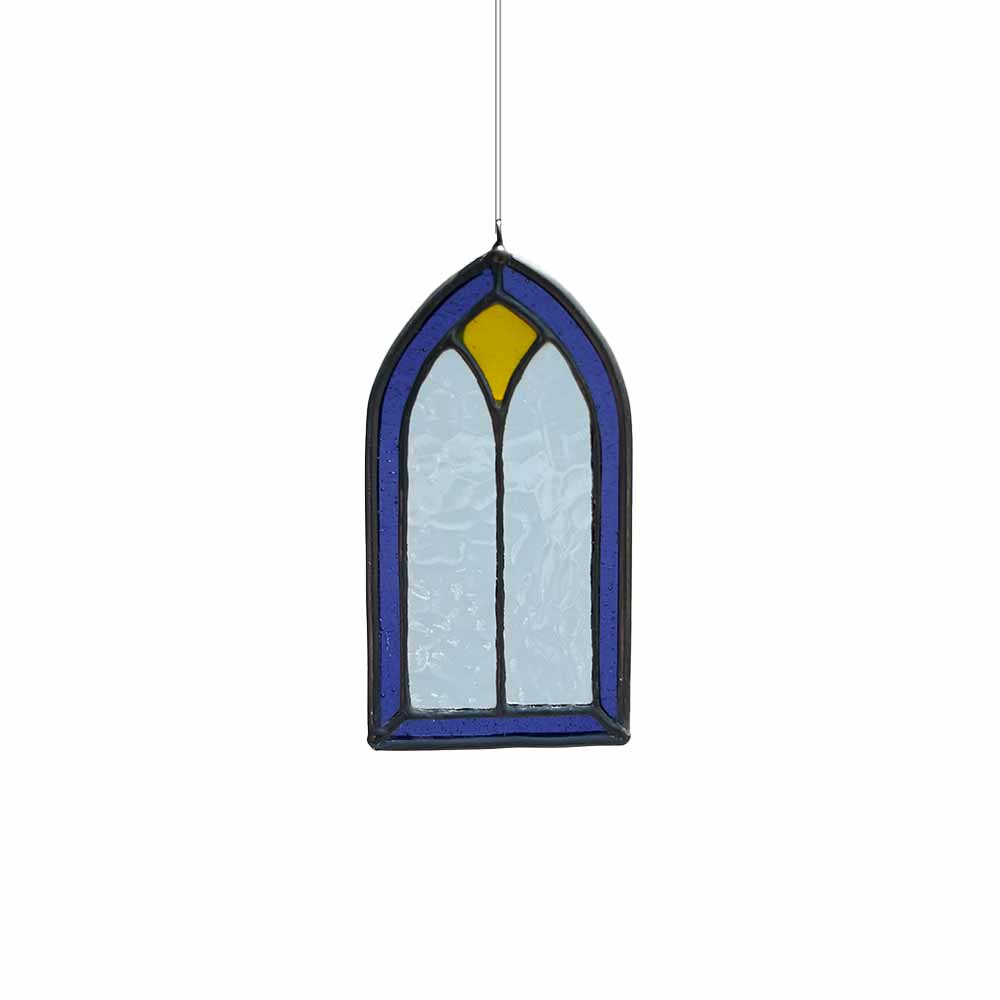 Stained glass window panel with lavender and yellow glass on a white background