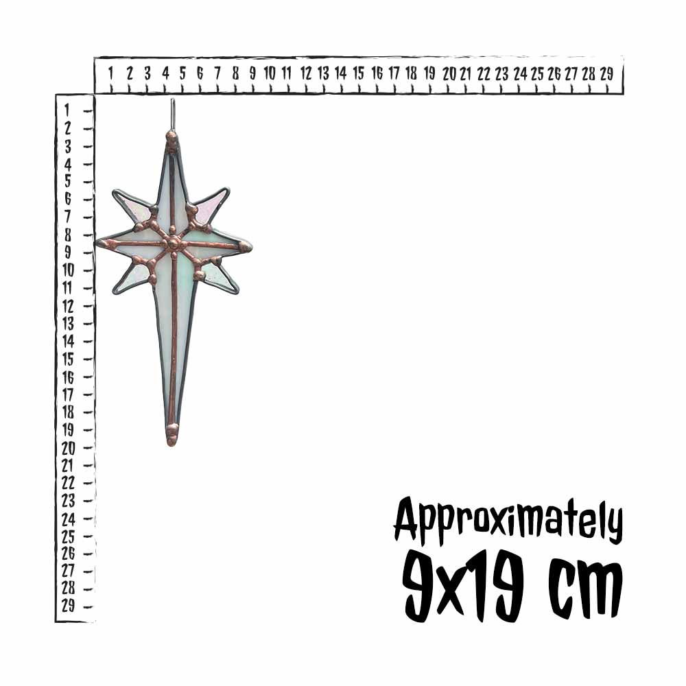 Decorative star-shaped object with a ruler for scale on a white background