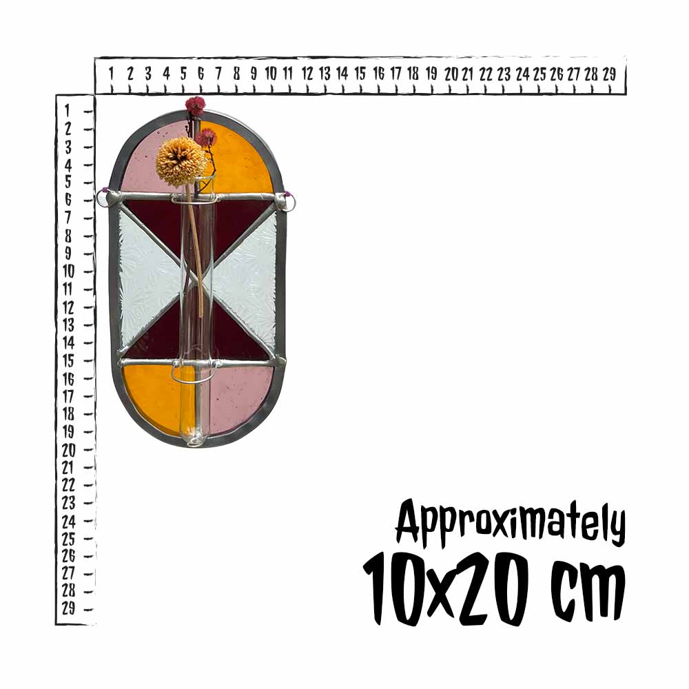 Decorative stained glass propagation station with a ruler for scale on a white background