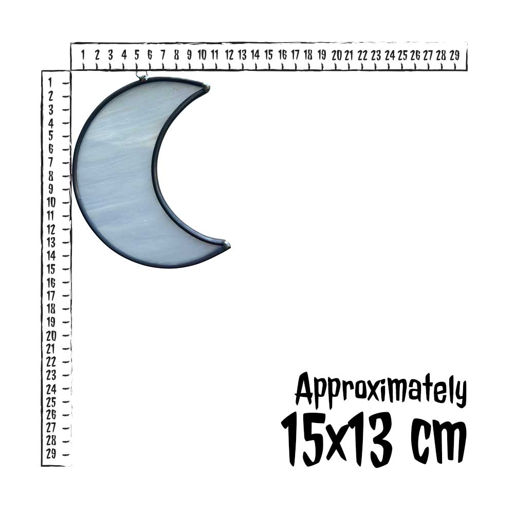 Moon-shaped white stained glass piece with a ruler for scale on a white background