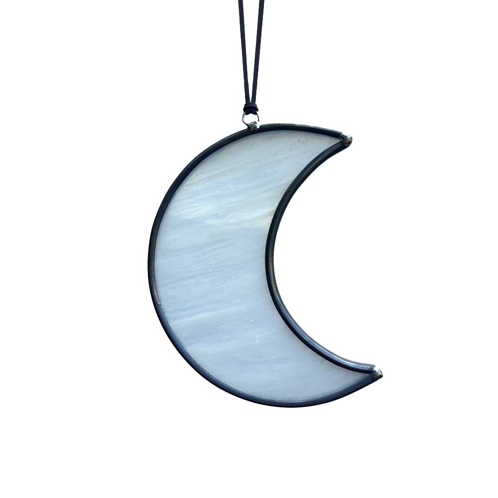 White crescent moon-shaped decor piece on a white background